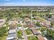 An aerial shot shows home's location near the river, downtown, and Raymond James Stadium at 5812 Blossom Ave, Tampa, FL 33614