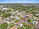 A wide aerial perspective showcasing the home's lush surroundings and neighborhood layout at 5812 Blossom Ave, Tampa, FL 33614