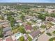 A vibrant aerial view shows the neighborhood's charming homes and verdant landscape at 5812 Blossom Ave, Tampa, FL 33614