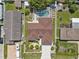 Aerial view of the home featuring a backyard pool, privacy fence and mature landscaping at 5812 Blossom Ave, Tampa, FL 33614