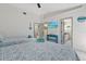 Bedroom includes ensuite bathroom, closet, and coastal decor at 5812 Blossom Ave, Tampa, FL 33614