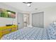 Comfortable bedroom features TV, ensuite bath, and closet space at 5812 Blossom Ave, Tampa, FL 33614
