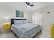 Cozy bedroom featuring a queen-sized bed, bright linens, and stylish accents, offering a tranquil retreat at 5812 Blossom Ave, Tampa, FL 33614