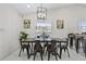 Bright dining room, with modern lighting and art, offers a comfortable space for meals and gatherings at 5812 Blossom Ave, Tampa, FL 33614