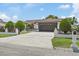 Charming single-story home boasts a long driveway and manicured landscaping at 5812 Blossom Ave, Tampa, FL 33614