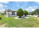 Charming front yard featuring manicured landscaping and inviting curb appeal of the home at 5812 Blossom Ave, Tampa, FL 33614