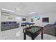 Spacious game room features a foosball table, pool table, and seating at 5812 Blossom Ave, Tampa, FL 33614