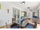 Bright sunroom with table and chairs, seamlessly connected to other living spaces at 5812 Blossom Ave, Tampa, FL 33614