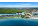Stunning aerial view showcasing a coastal condo community surrounded by water at 611 Destiny Dr, Ruskin, FL 33570