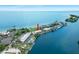 Aerial view of waterfront condo community featuring lush landscaping and marina access at 611 Destiny Dr, Ruskin, FL 33570