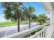 Condo balcony view with palm trees and parking in a desirable community at 611 Destiny Dr, Ruskin, FL 33570