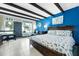 Bright bedroom with a nautical theme, featuring a king-size bed and view to the outside at 611 Destiny Dr, Ruskin, FL 33570