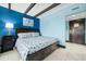 Comfortable bedroom featuring a queen-size bed, accent wall and stylish modern decor at 611 Destiny Dr, Ruskin, FL 33570