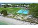 A beautiful beachside park area featuring a tennis court, green space, and playground at 611 Destiny Dr, Ruskin, FL 33570