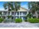 Inviting two-story condo building with manicured landscaping and bright yellow accents at 611 Destiny Dr, Ruskin, FL 33570