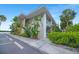 Two-story condo building with well-maintained landscaping, parking, and lush greenery surrounding the property at 611 Destiny Dr, Ruskin, FL 33570