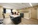 Well-lit game room featuring an air hockey table and other games for leisure and entertainment at 611 Destiny Dr, Ruskin, FL 33570