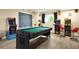Basement recreational game room featuring a pool table and arcade games at 611 Destiny Dr, Ruskin, FL 33570