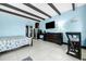 Cozy living area with light blue walls and a queen-size bed at 611 Destiny Dr, Ruskin, FL 33570