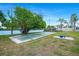 Community recreation area, featuring a bocce ball court and lush tropical landscaping at 611 Destiny Dr, Ruskin, FL 33570