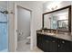 Bathroom with a toilet, granite vanity, and glass-enclosed shower at 6127 Colmar Pl, Apollo Beach, FL 33572