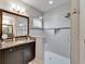 Bathroom with granite vanity, glass shower, and modern finishes at 6127 Colmar Pl, Apollo Beach, FL 33572
