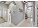 Open-concept foyer with tile flooring leading to living areas and laundry room at 6127 Colmar Pl, Apollo Beach, FL 33572