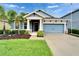 Charming single-Gathering home with well-manicured lawn and tropical landscaping at 6127 Colmar Pl, Apollo Beach, FL 33572