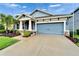 Charming single-Gathering home with well-manicured lawn and tropical landscaping at 6127 Colmar Pl, Apollo Beach, FL 33572