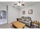 Comfortable seating in this bonus room features a reclining sofa and a wooden coffee table at 6127 Colmar Pl, Apollo Beach, FL 33572