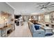 Expansive view of the open-concept living area highlighting the living room, dining room, and modern kitchen at 6127 Colmar Pl, Apollo Beach, FL 33572