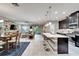 Open floor plan with island kitchen, living room and dining area, seamlessly connected at 6127 Colmar Pl, Apollo Beach, FL 33572