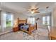 Spacious main bedroom boasting a ceiling fan, large windows, and natural light at 6127 Colmar Pl, Apollo Beach, FL 33572