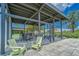Open-air patio area with comfortable seating and views of the pool at 6127 Colmar Pl, Apollo Beach, FL 33572