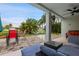 Inviting outdoor patio area, furnished with a comfortable seating, overlooking a serene waterfront view at 6416 Grenada Island Ave, Apollo Beach, FL 33572