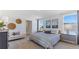Stylish bedroom with a comfortable bed, bench, and accent decor at 6899 Broad River Ave, Land O Lakes, FL 34638