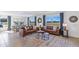 Bright and airy living room featuring neutral walls, stylish decor, and expansive windows at 6899 Broad River Ave, Land O Lakes, FL 34638