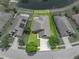 An aerial view showing the home's location with a pond view and proximity to neighboring properties at 6957 Boulder Run Loop, Wesley Chapel, FL 33545