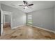 Bedroom featuring neutral paint, tile floors, window, and ceiling fan with light at 6957 Boulder Run Loop, Wesley Chapel, FL 33545