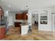 Spacious kitchen featuring ample cabinet space, granite countertops, and a breakfast bar at 6957 Boulder Run Loop, Wesley Chapel, FL 33545