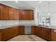 A modern kitchen with granite countertops, stainless steel appliances, and tile backsplash at 6957 Boulder Run Loop, Wesley Chapel, FL 33545