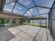 Large tile screened patio provides great views of the green backyard at 6957 Boulder Run Loop, Wesley Chapel, FL 33545