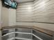 Safe room including shelving and countertops for storage of valuable items at 6957 Boulder Run Loop, Wesley Chapel, FL 33545