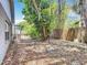 Spacious backyard with mature trees and a wooden fence providing privacy at 7613 Bramblewood Dr, Port Richey, FL 34668