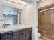 Bathroom featuring a vanity and a tiled walk-in shower at 7613 Bramblewood Dr, Port Richey, FL 34668