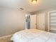 A bedroom with a closet and a built-in shelving unit at 7613 Bramblewood Dr, Port Richey, FL 34668