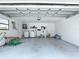 Spacious garage with laundry machines and lots of space for storage at 7613 Bramblewood Dr, Port Richey, FL 34668