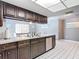 Kitchen sink with updated fixtures and view into the dining area at 7613 Bramblewood Dr, Port Richey, FL 34668