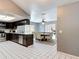 Open kitchen view into dining area featuring stainless steel appliances and abundant counter space at 7613 Bramblewood Dr, Port Richey, FL 34668