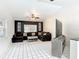 Bright living room featuring white tile floors, vaulted ceilings, and comfortable seating arrangement at 7613 Bramblewood Dr, Port Richey, FL 34668
